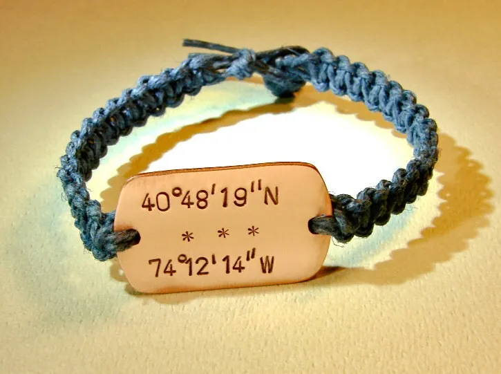 Personalized latitude longitude coordinates on a copper tag with woven blue hemp bracelet